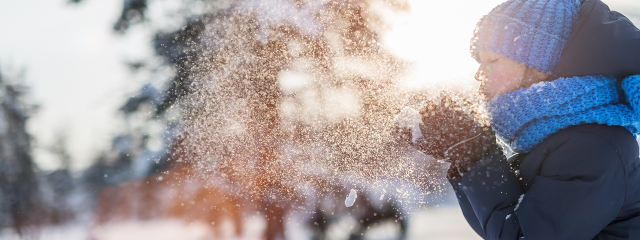 Person blows snow